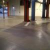 Auto mechanic shop after cleaning and sealing concrete floor
